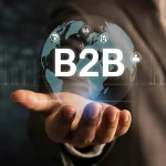 Main ouverte sous un globe terrestre lumineux portant l'inscription B2B