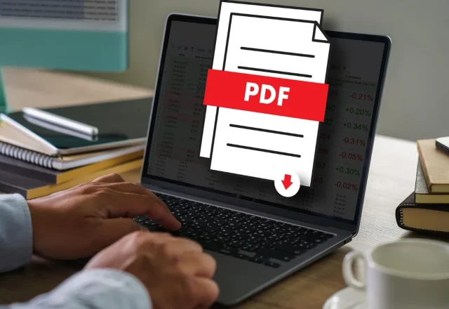 Personne travaillant sur un ordinateur portable, avec une icône de document PDF en surimpression